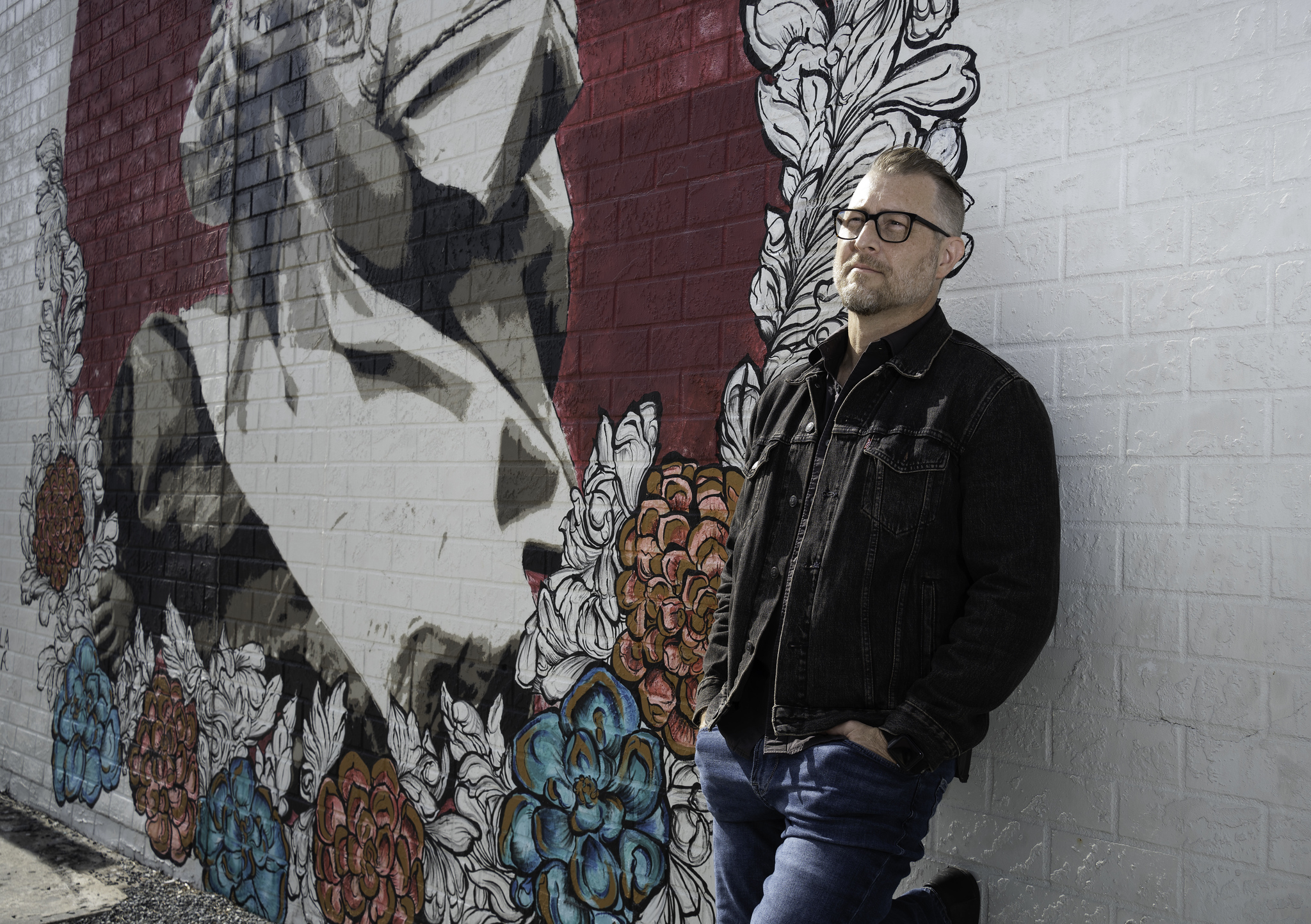 Jason Clark by the flower mural wall